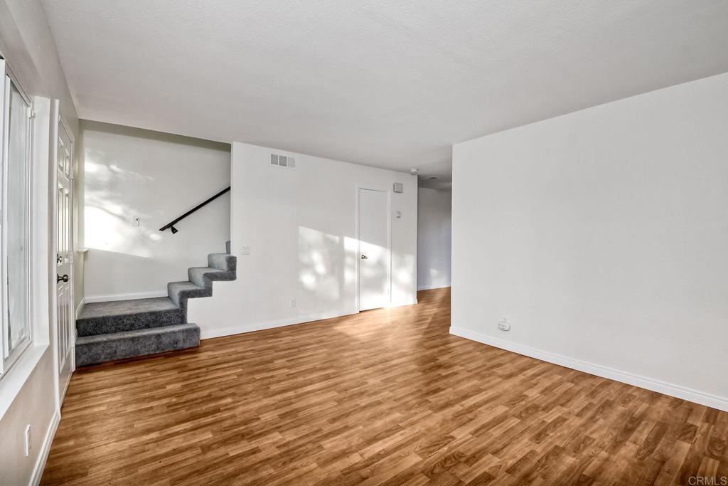 3605 Surfline Way Oceanside, CA 92056 - Photo 8 of 32 a view of an empty room with wooden floor