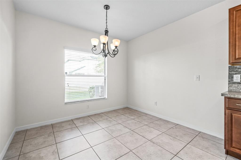 16713 Scenic Hill Way Wimauma, FL 33598 - Photo 14 of 52 a view of an empty room with a window