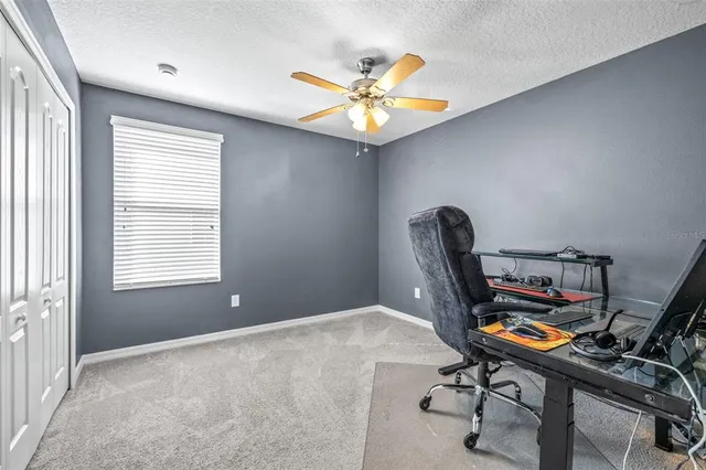 a workspace with furniture and window