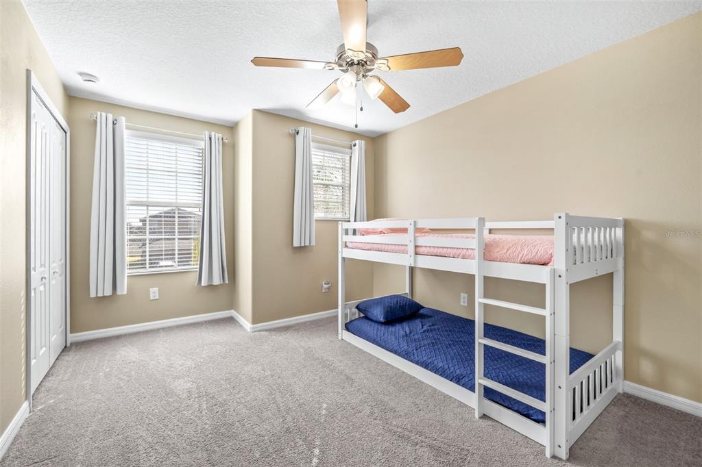 16713 Scenic Hill Way Wimauma, FL 33598 - Photo 32 of 52 a bedroom with bed and a window