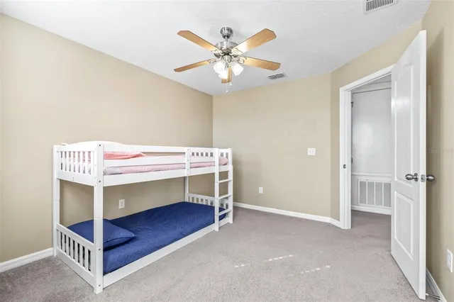 a bedroom with bed and a table