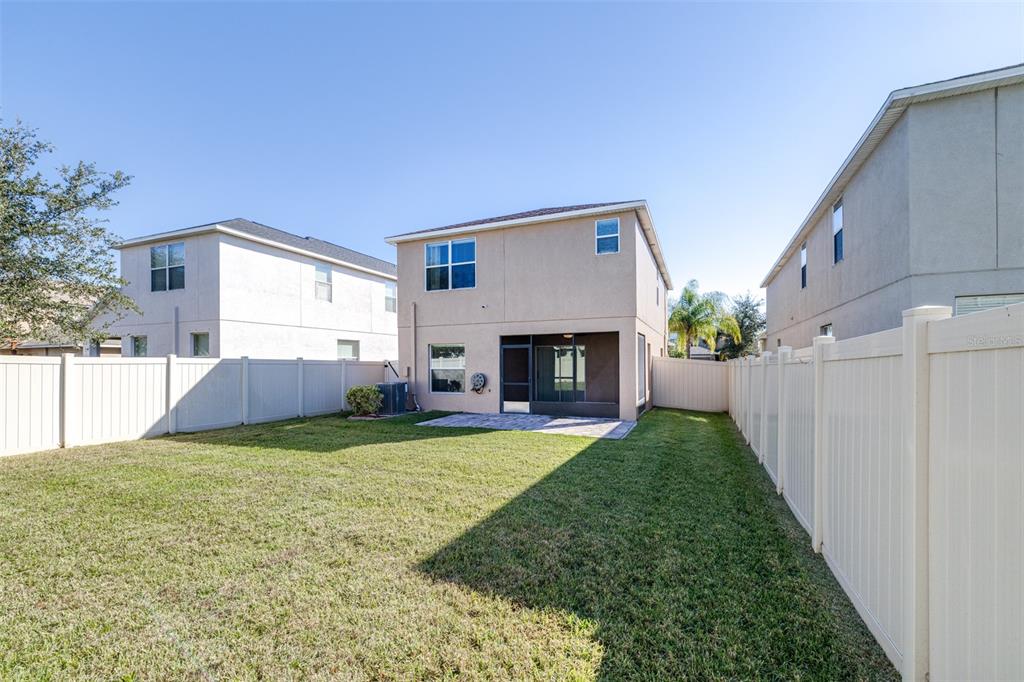 16713 Scenic Hill Way Wimauma, FL 33598 - Photo 42 of 52 a view of a house with a porch and a yard