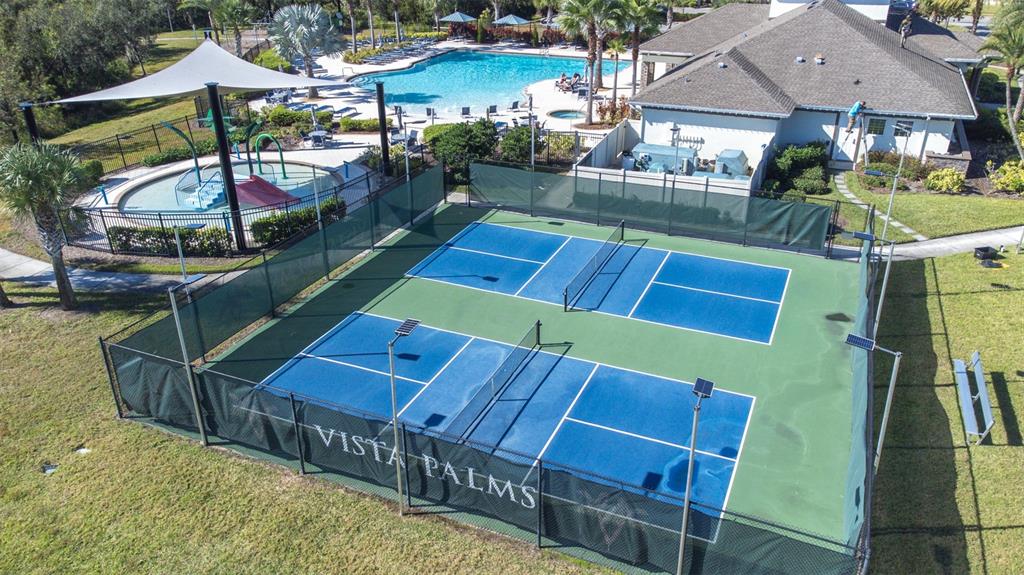 16713 Scenic Hill Way Wimauma, FL 33598 - Photo 49 of 52 a view of a chairs and table on the deck