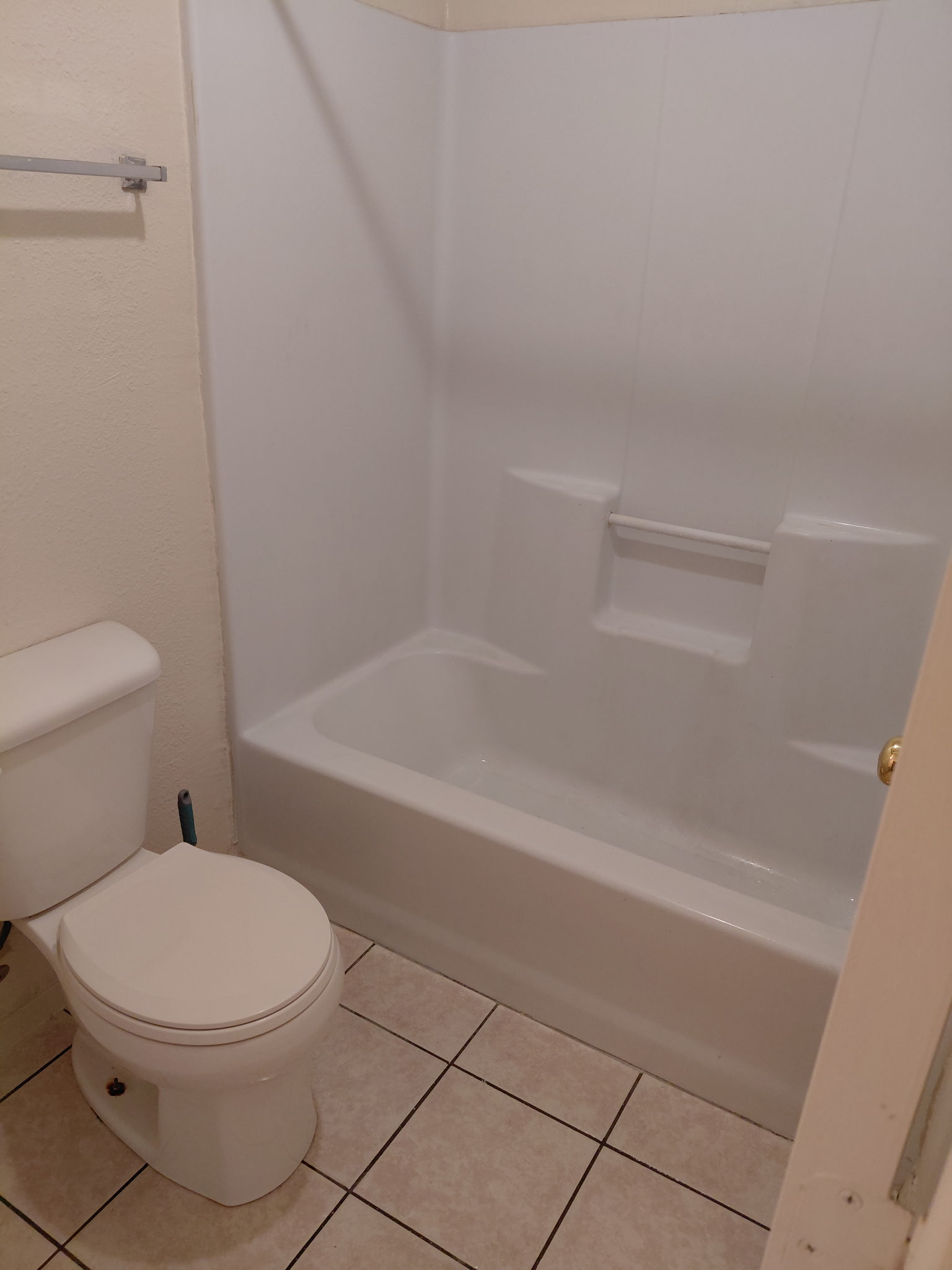 2218 Katy Lane Georgetown, TX 78626 - Photo 6 of 10 a white toilet and tub sitting next to a bathroom sink