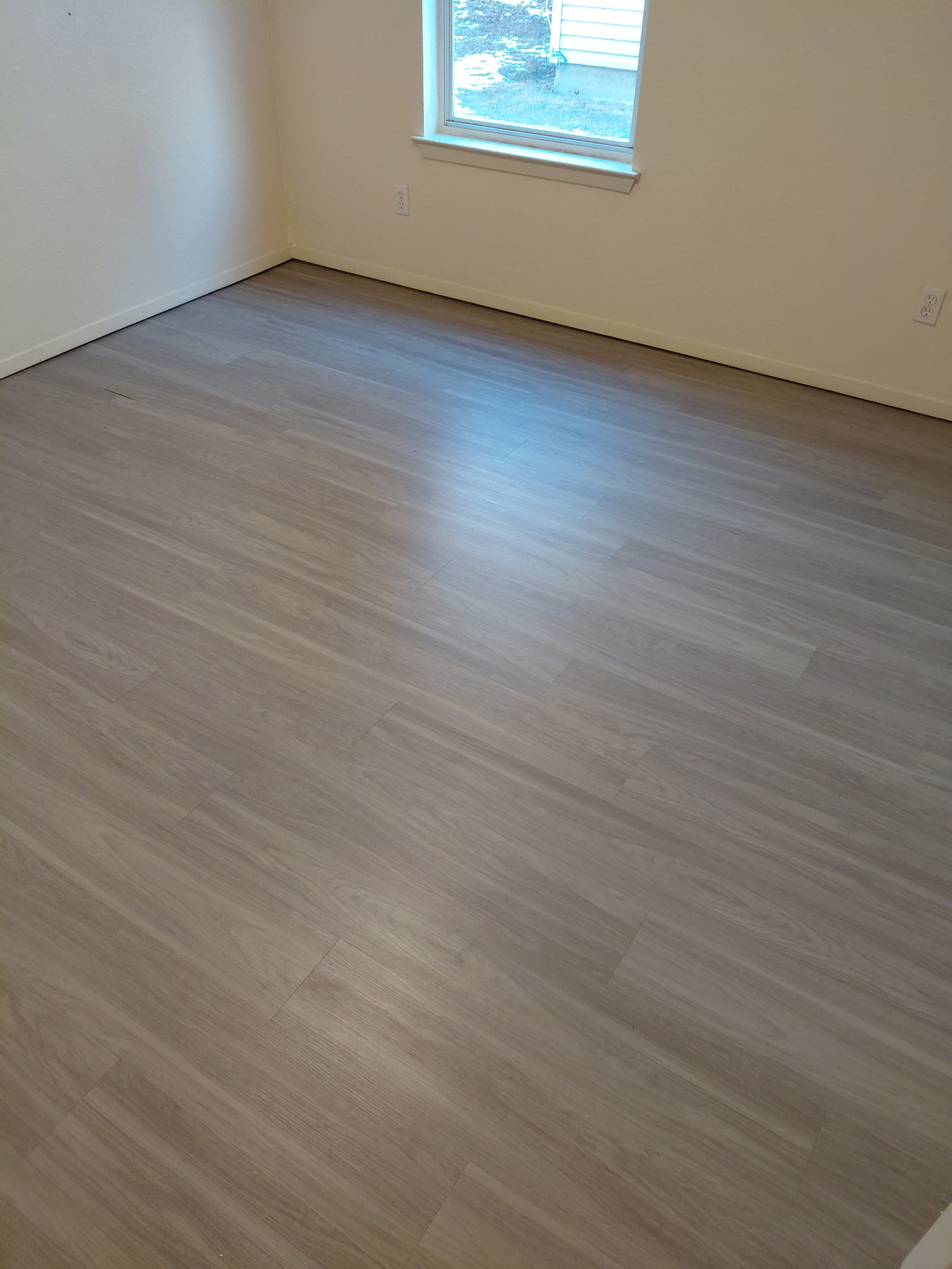 2218 Katy Lane Georgetown, TX 78626 - Photo 7 of 10 an empty room with wooden floor and windows