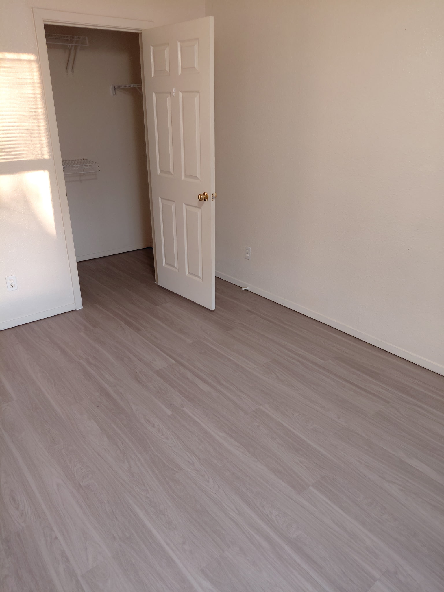 2218 Katy Lane Georgetown, TX 78626 - Photo 9 of 10 an empty room with wooden floor and windows