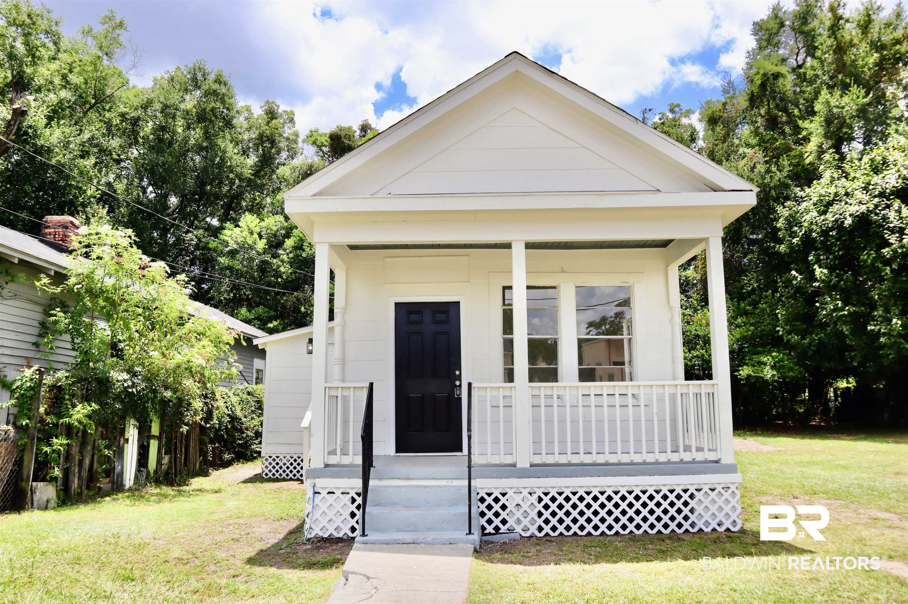 1009 Baltimore Street Mobile, AL 36605 - Photo 1 of 17 View of front of house with a porch and a front yard