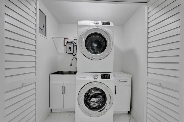 a utility room with dryer and washer