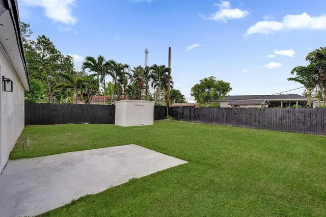a view of a backyard with a garden and plants
