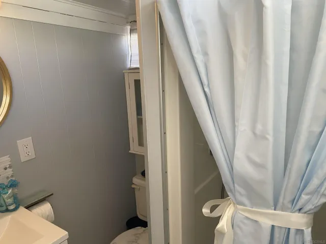 a view of a hallway with seating space