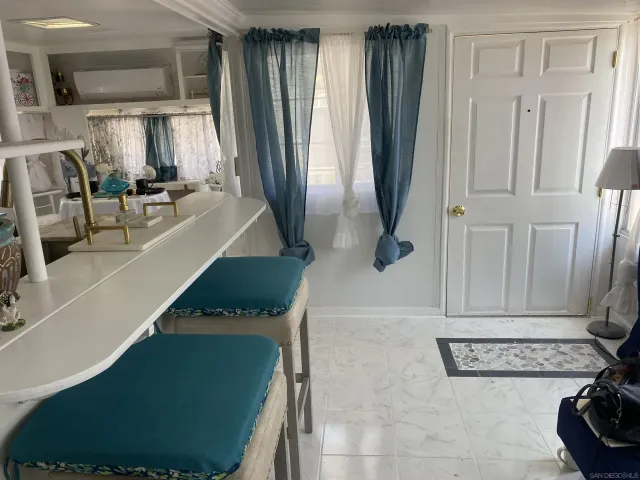 a view of a living room with a fireplace and cabinets