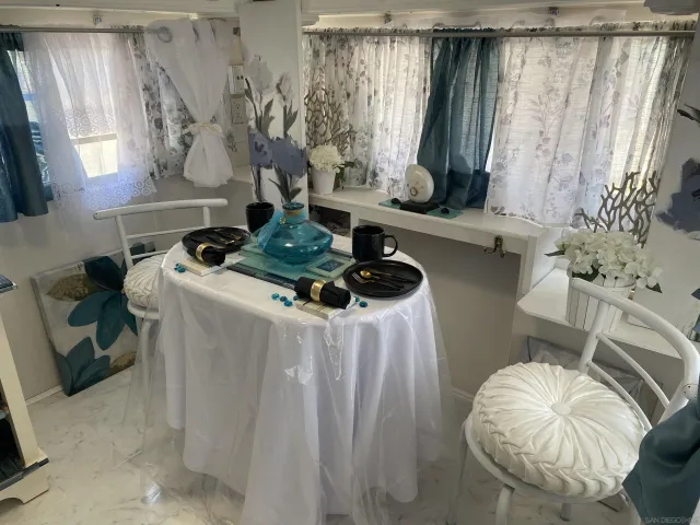 a white bath tub sitting next to a white toilet