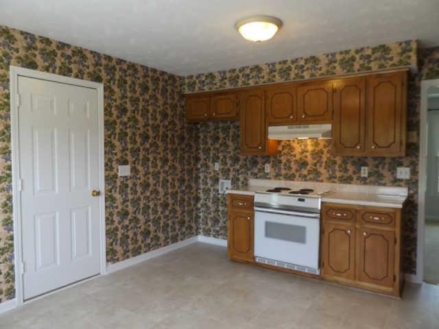 902 Franklin Road Charlotte, TN 37036 - Photo 14 of 20 View 2 of Kitchen / Pretty cabinets / Door is to Garage
