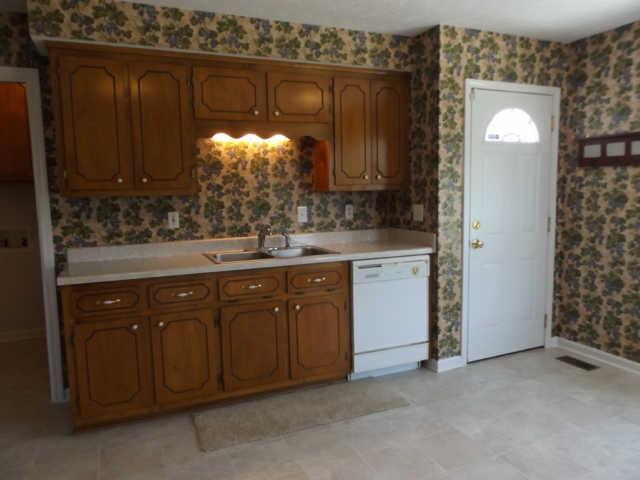 902 Franklin Road Charlotte, TN 37036 - Photo 15 of 20 View 3 of Kitchen / Door to right is to the Deck / Opening on Left is Utility Room