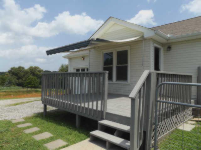 902 Franklin Road Charlotte, TN 37036 - Photo 19 of 20 Beautifully finished Deck has a crank out Awning. Lovely place to sit and enjoy your evenings!!!