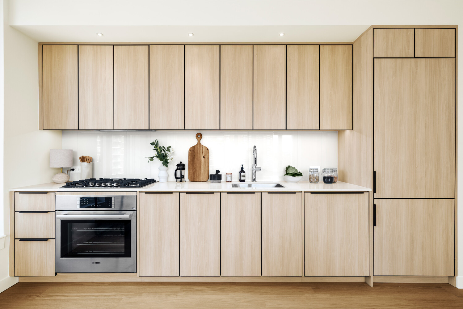 280 West 24th Street, Unit 6P Manhattan, NY 10011 - Photo 2 of 19 a kitchen with granite countertop white cabinets and stainless steel appliances