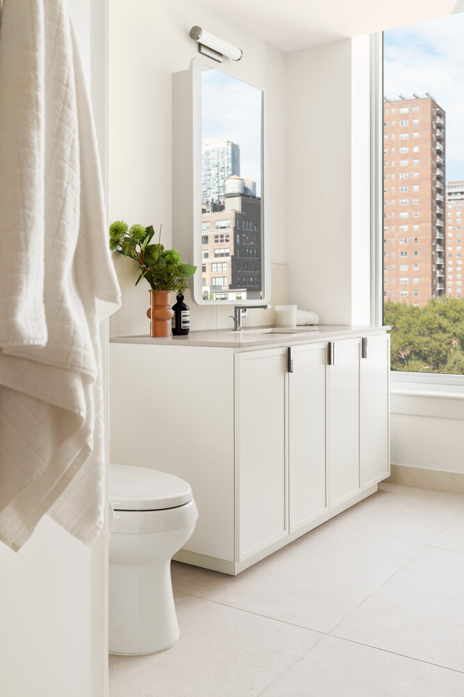 280 West 24th Street, Unit 6P Manhattan, NY 10011 - Photo 8 of 19 a bathroom with a sink and mirror with window