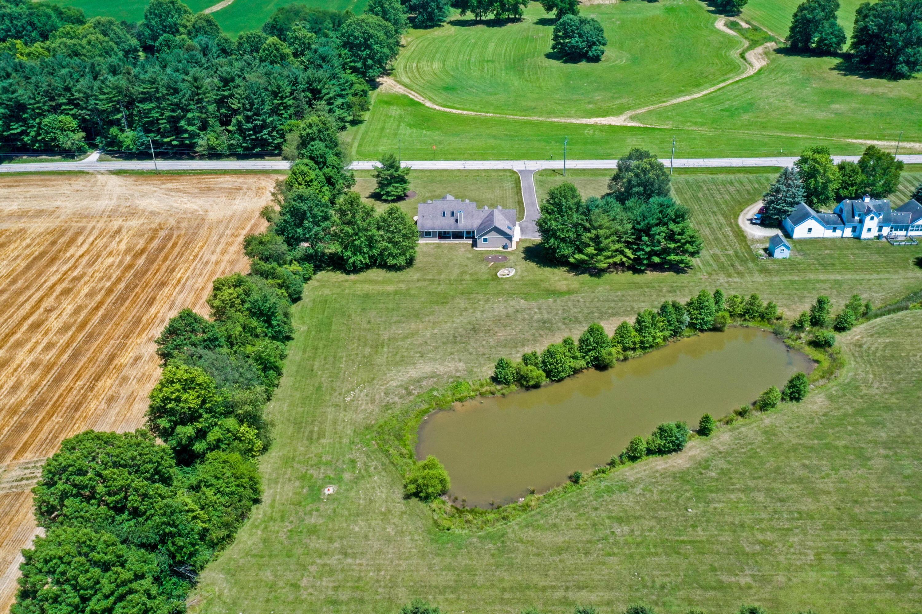 2828 Rome Corners Road Galena, OH 43021 - Photo 55 of 66 VIEW OF HOME WITH POND BEHIND