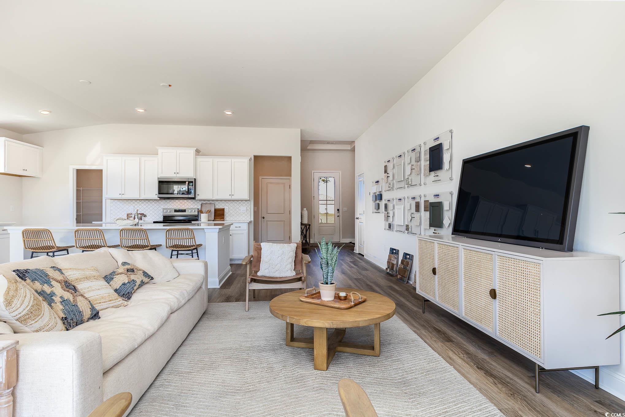 187 Bjorn Way Loris, SC 29569 - Photo 19 of 40 Living area featuring wood finished floors, lofted ceiling, and recessed lighting