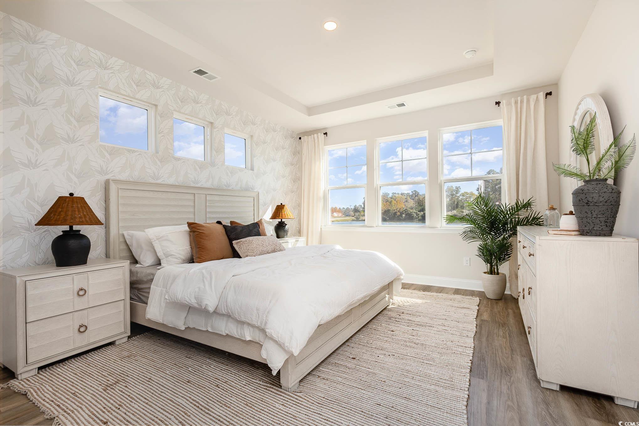 187 Bjorn Way Loris, SC 29569 - Photo 21 of 40 Bedroom featuring a raised ceiling, light wood-style floors, and recessed lighting