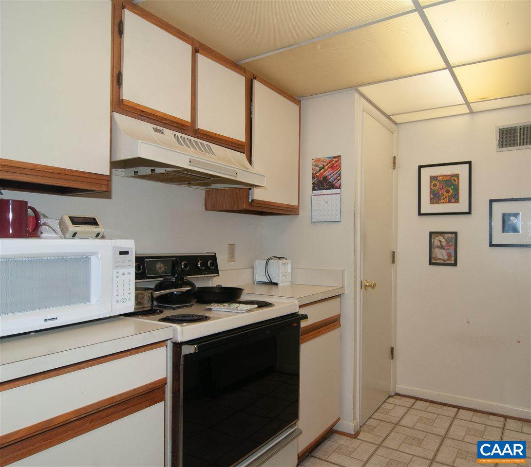 101-8 Turtle Creek Road Charlottesville, VA 22901 - Photo 11 of 21 a kitchen with stainless steel appliances a sink stove and cabinets