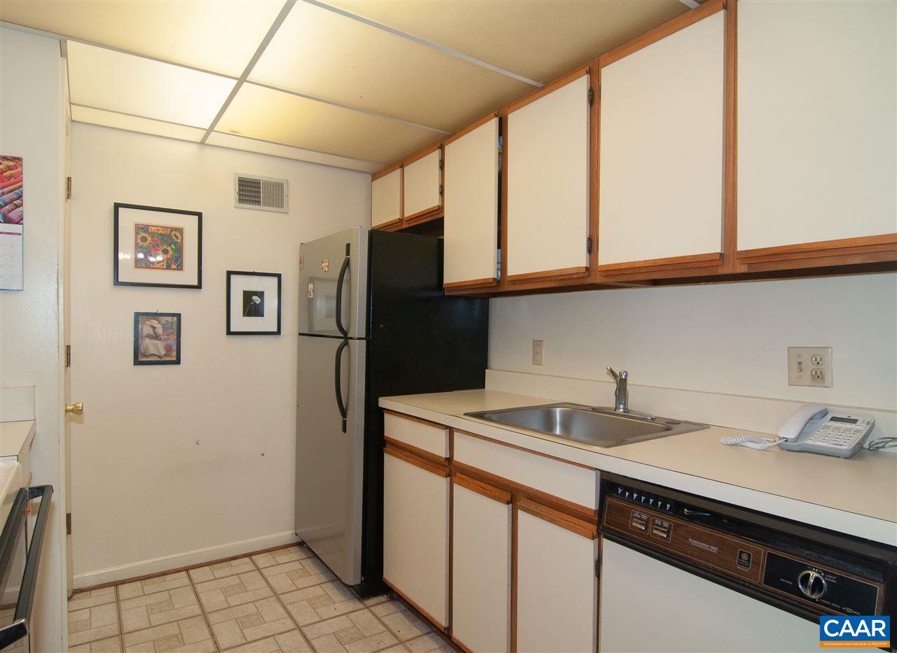 101-8 Turtle Creek Road Charlottesville, VA 22901 - Photo 12 of 21 a kitchen with stainless steel appliances granite countertop a refrigerator and a sink