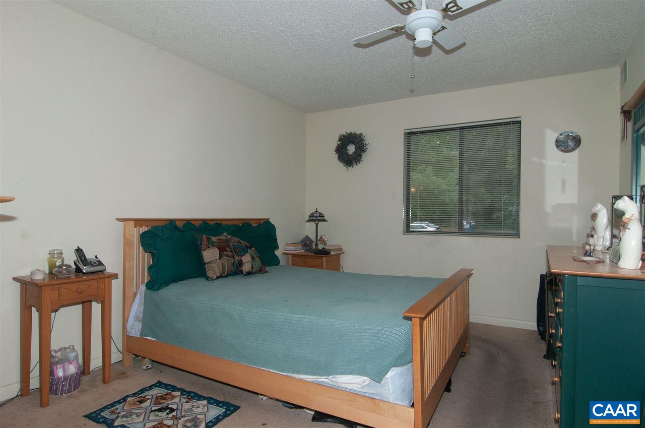 101-8 Turtle Creek Road Charlottesville, VA 22901 - Photo 15 of 21 a bedroom with a bed and window