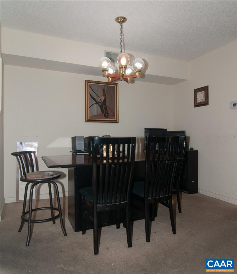 101-8 Turtle Creek Road Charlottesville, VA 22901 - Photo 7 of 21 a view of a dining room with furniture and chandelier