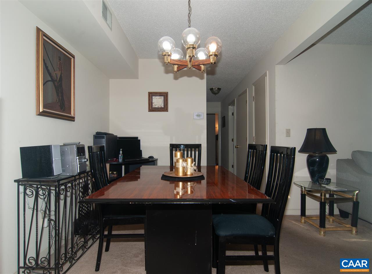 101-8 Turtle Creek Road Charlottesville, VA 22901 - Photo 9 of 21 a view of a dining room with furniture and chandelier