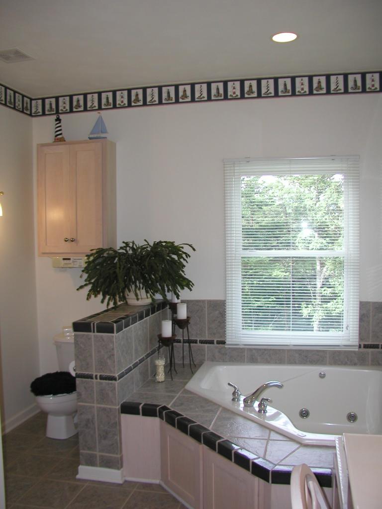 2905 New Ridge Road Elliston, VA 24087 - Photo 6 of 11 a bathroom with a granite countertop sink a mirror and a shower