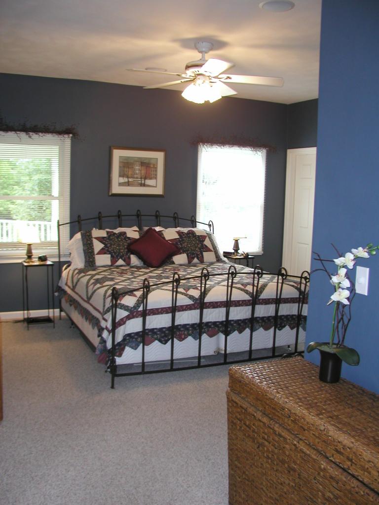 2905 New Ridge Road Elliston, VA 24087 - Photo 8 of 11 a bedroom with a bed and a chandelier