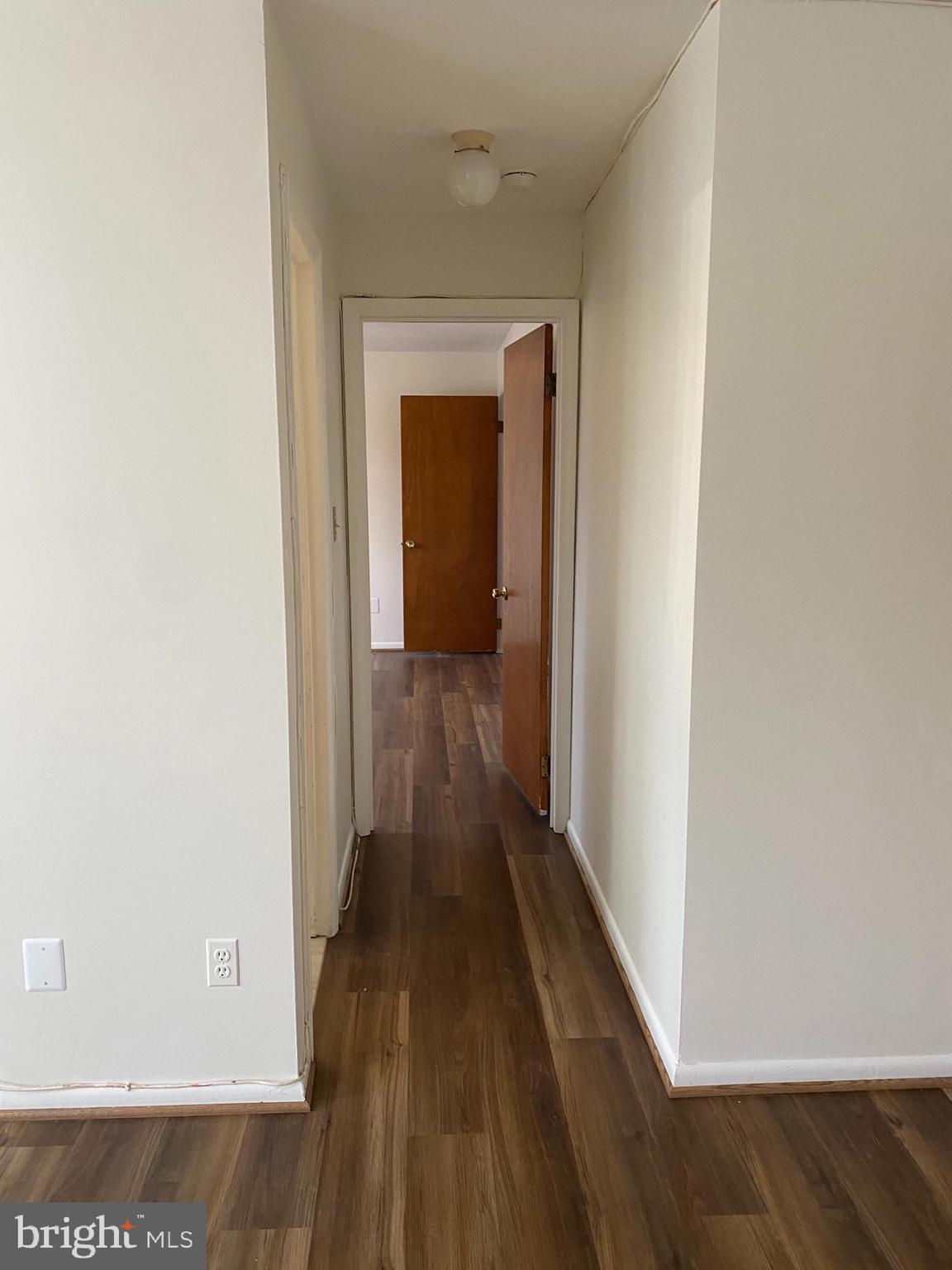 5101 8th Road South, Unit 102 Arlington, VA 22204 - Photo 11 of 22 a view of a hallway with wooden floor