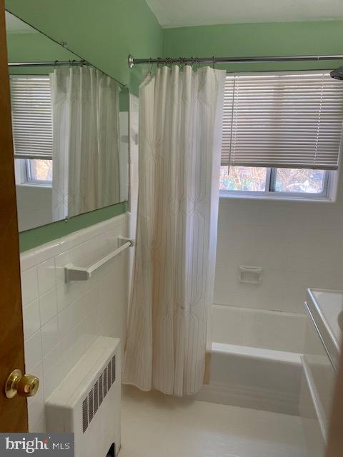 5101 8th Road South, Unit 102 Arlington, VA 22204 - Photo 20 of 22 a bathroom with a shower curtain and a sink