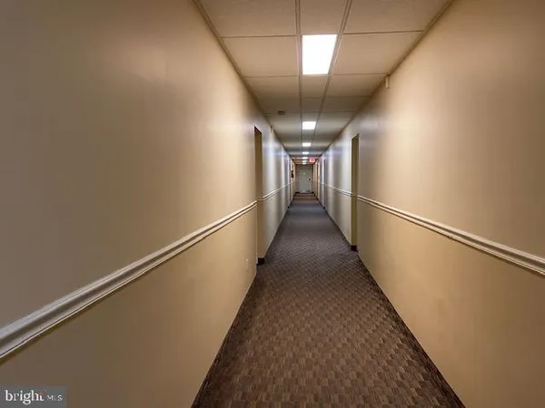 a view of a hallway with stairs
