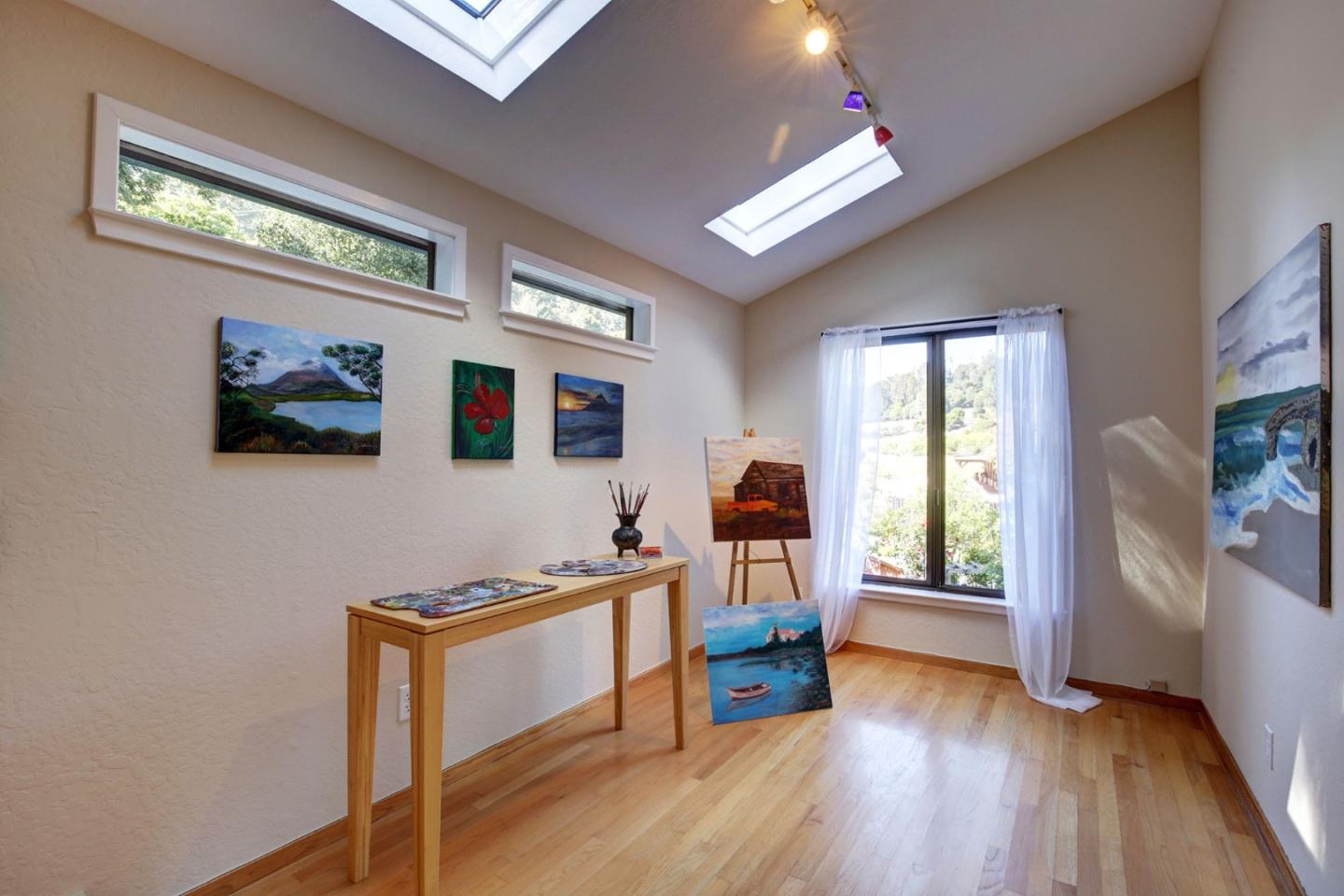 450 Bear Valley Road Aptos, CA 95003 - Photo 21 of 46 a view of a workspace with furniture and a window