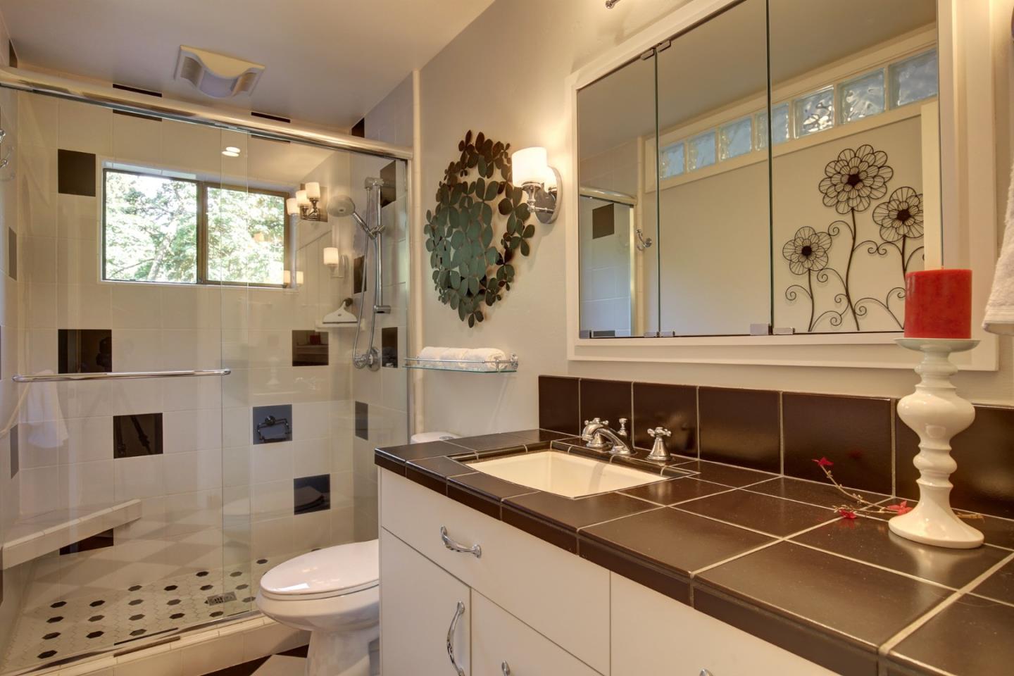 450 Bear Valley Road Aptos, CA 95003 - Photo 25 of 46 a bathroom with a sink toilet and shower