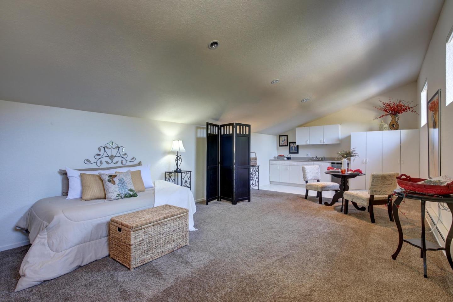 450 Bear Valley Road Aptos, CA 95003 - Photo 32 of 46 a bedroom with furniture and a bed