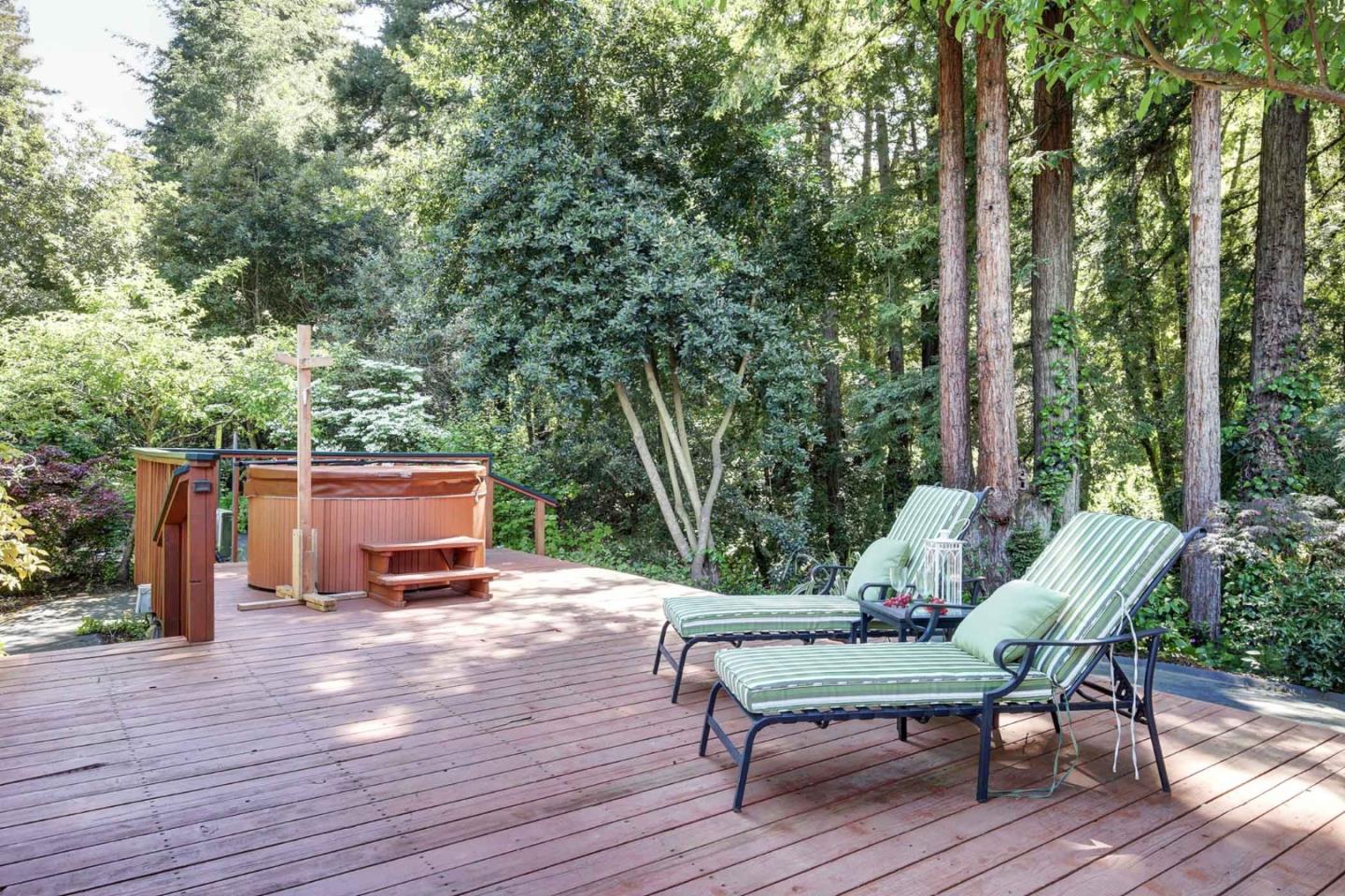 450 Bear Valley Road Aptos, CA 95003 - Photo 37 of 46 a wooden bench sitting on top of a wooden deck
