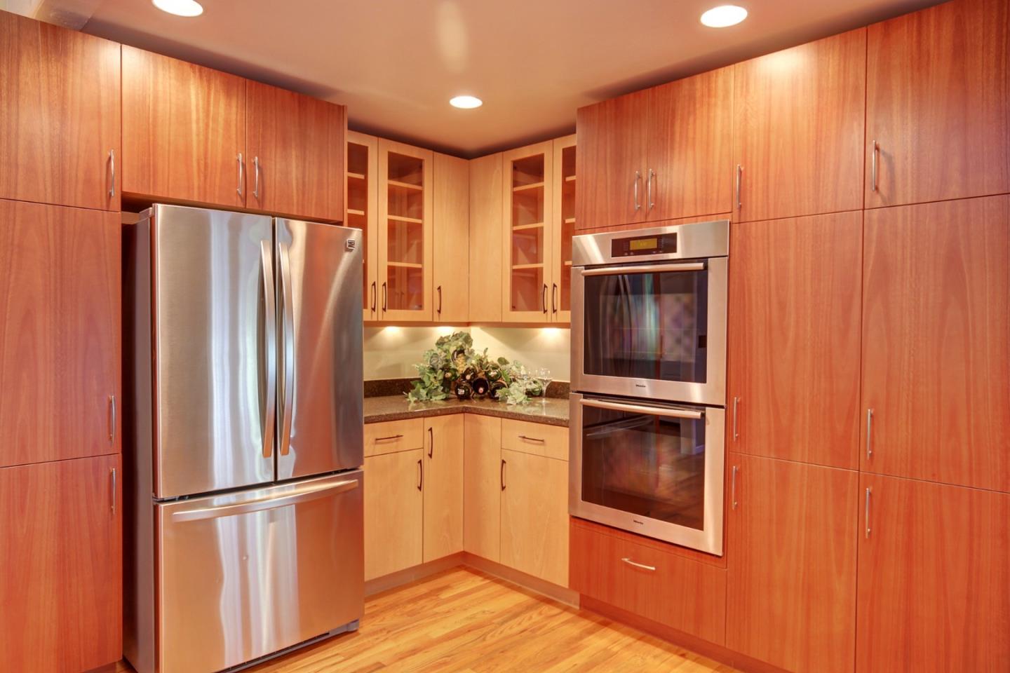 450 Bear Valley Road Aptos, CA 95003 - Photo 8 of 46 a metallic refrigerator freezer sitting in a kitchen