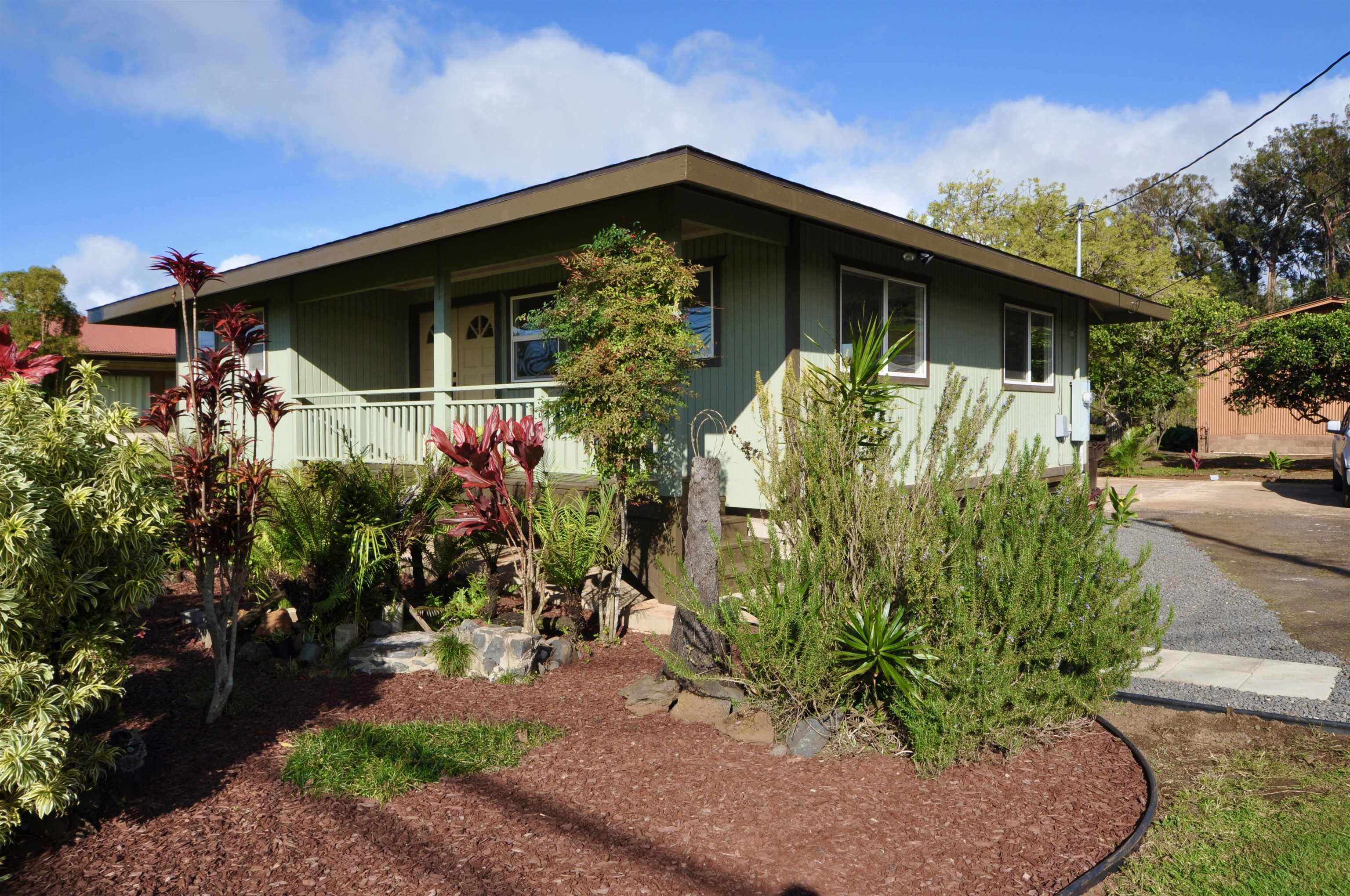 2835 Kaupakalua Road Haiku, HI 96708 - Photo 24 of 31 a view of a house with a yard