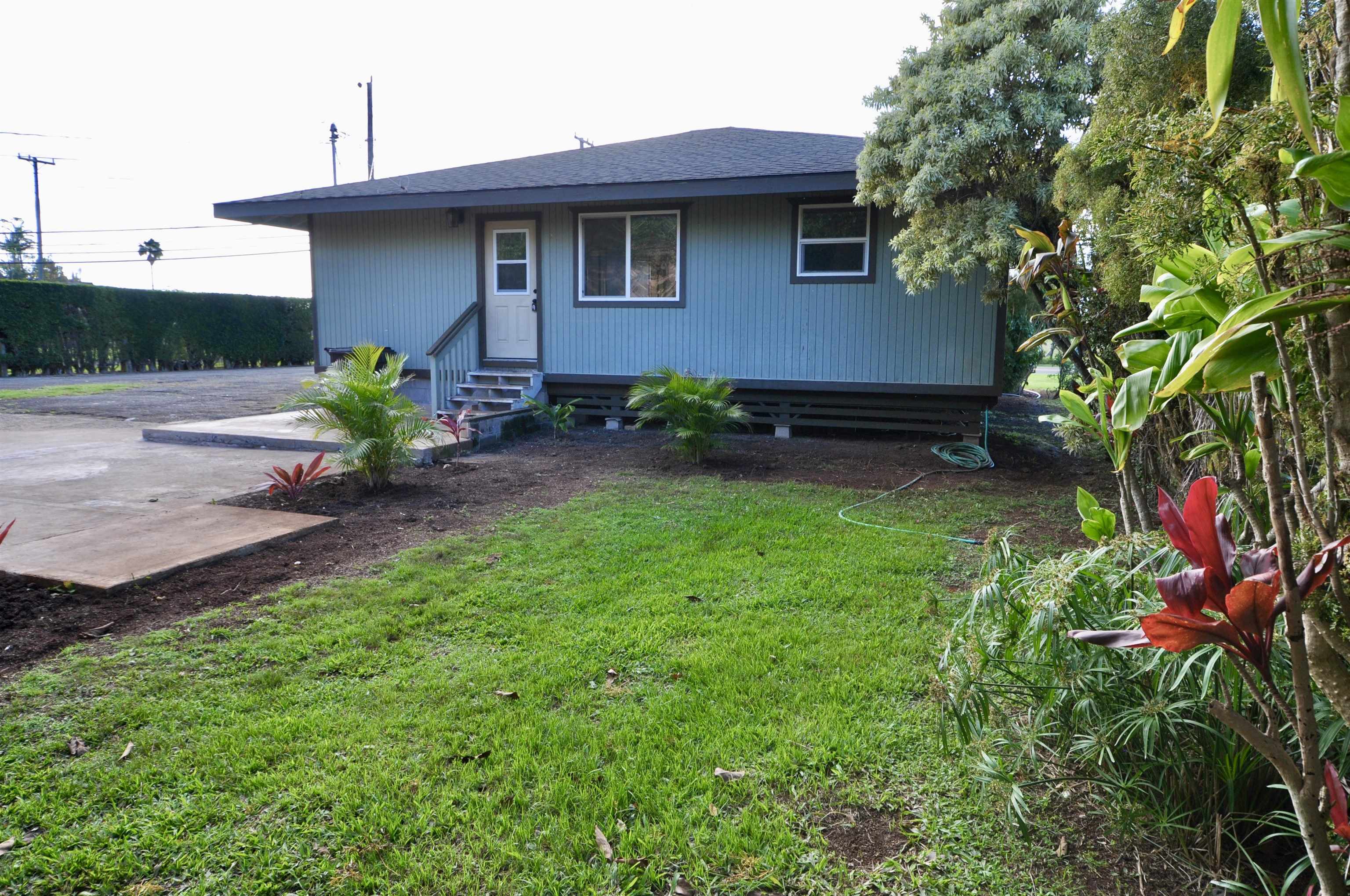 2835 Kaupakalua Road Haiku, HI 96708 - Photo 26 of 31 a view of a house with a yard