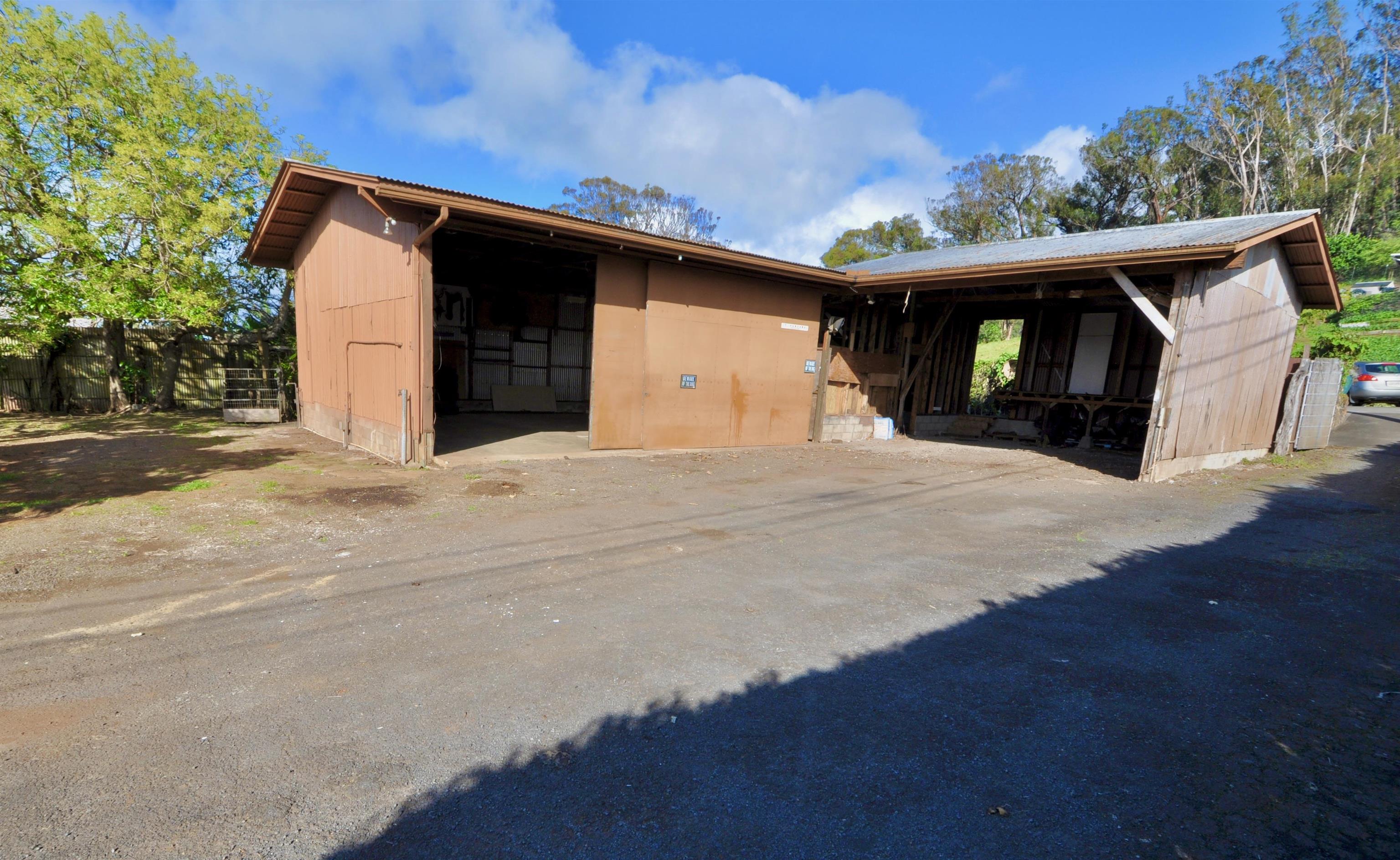2835 Kaupakalua Road Haiku, HI 96708 - Photo 27 of 31 a front view of a house with a yard