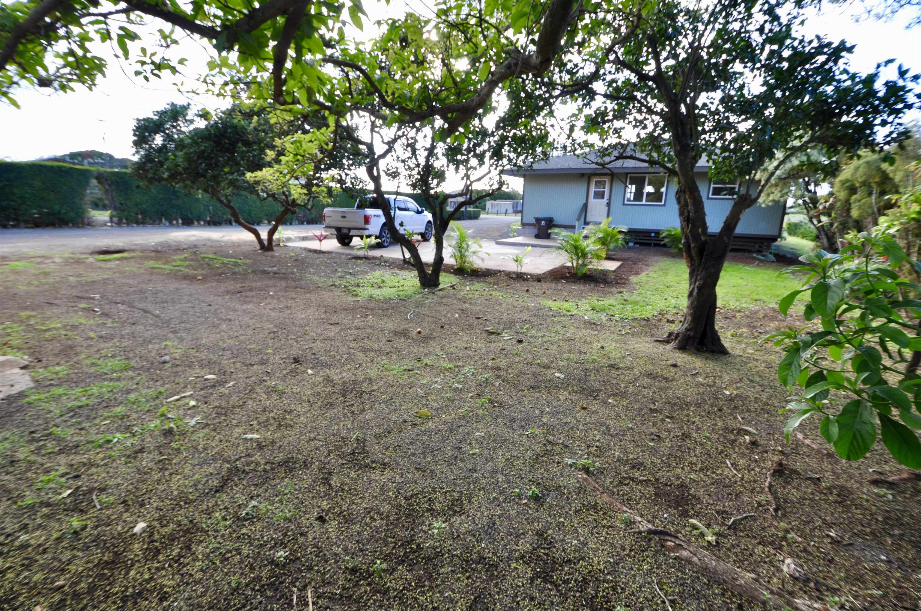 2835 Kaupakalua Road Haiku, HI 96708 - Photo 31 of 31 a view of a house with a yard