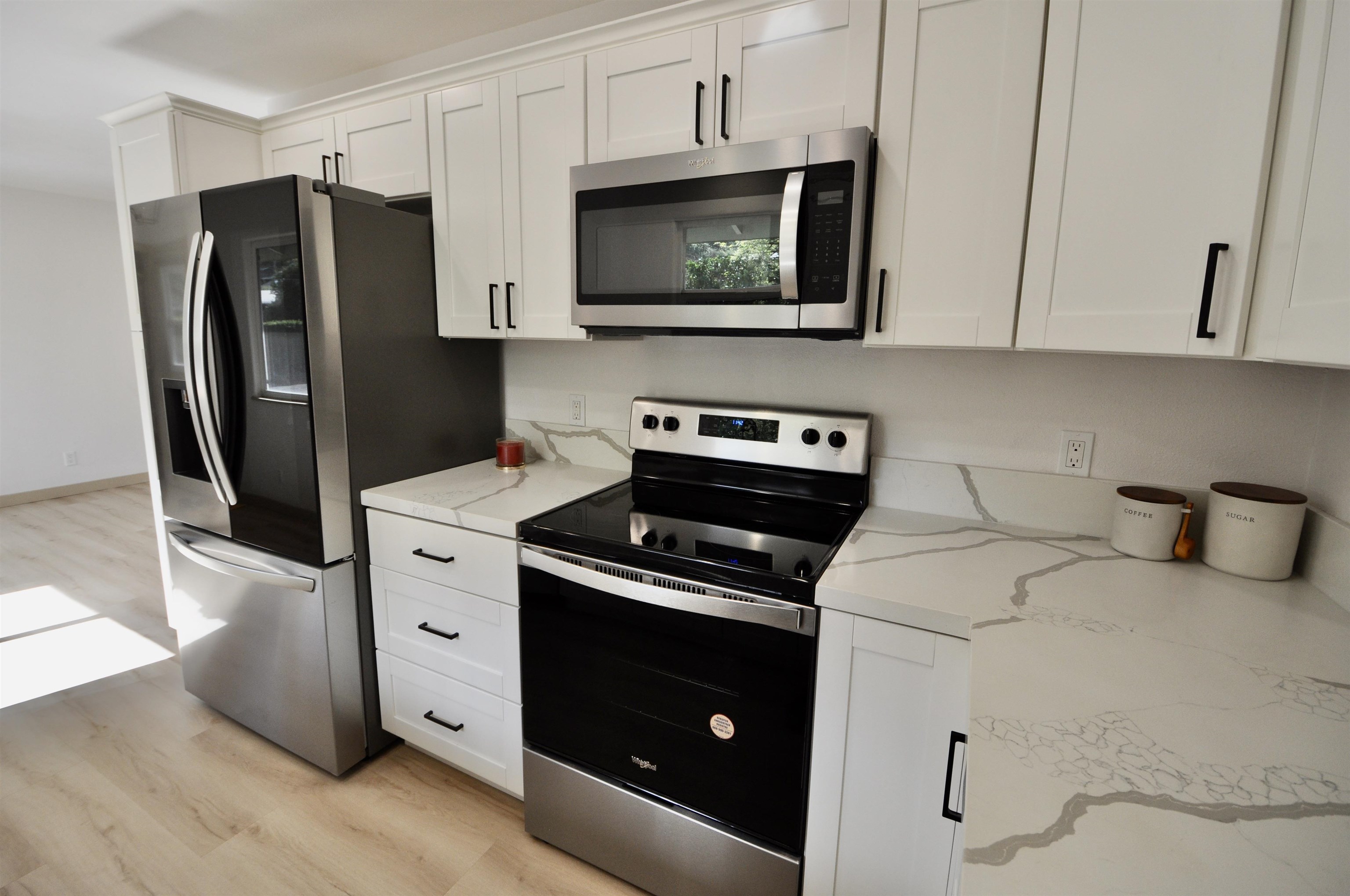 2835 Kaupakalua Road Haiku, HI 96708 - Photo 9 of 31 a kitchen with stainless steel appliances a stove a refrigerator and cabinets
