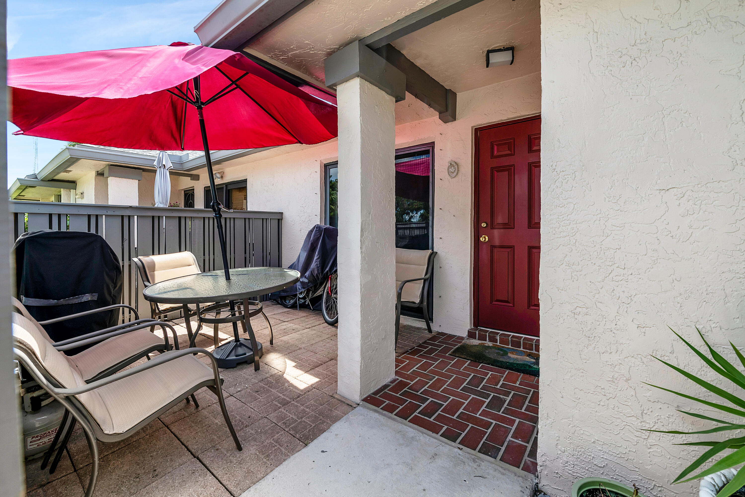 8440 Boca Glades Boulevard East Boca Raton, FL 33434 - Photo 1 of 16 a view of a chairs and table in the balcony