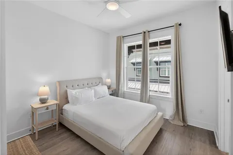 a bedroom with a large bed and a window