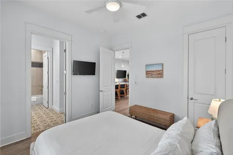 a bedroom with a bed and a television