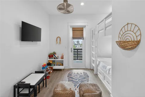a bedroom with furniture and a window