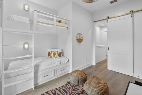 a bedroom with a bed and cabinets