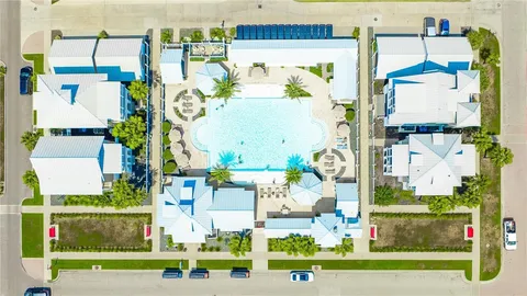 a view of a swimming pool with outdoor seating